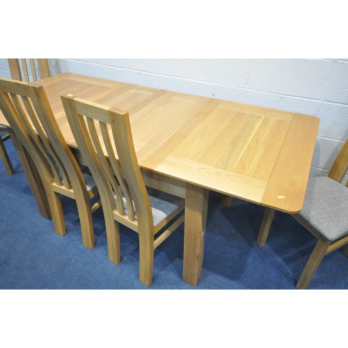 1299 - A MODERN LIGHT OAK EXTENDING DINING TABLE, with two additional leaves, extended length 199cm x close... 