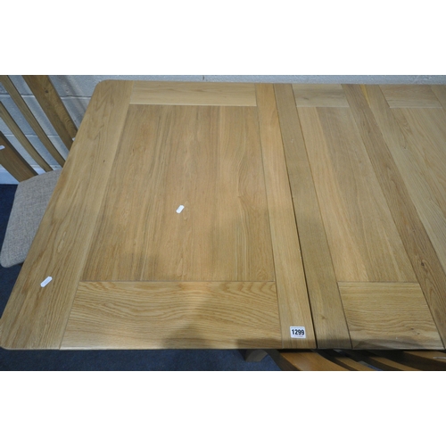 1299 - A MODERN LIGHT OAK EXTENDING DINING TABLE, with two additional leaves, extended length 199cm x close... 