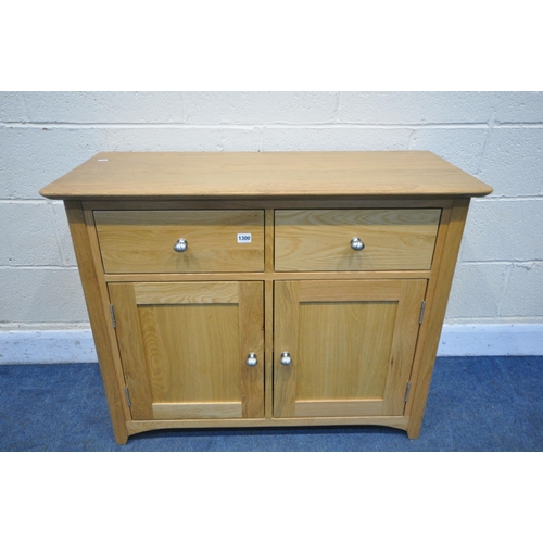 1300 - A MODERN LIGHT OAK SIDEBOARD, with two drawers, over double cupboard doors, width 98cm x depth 43cm ... 