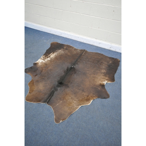 1320 - A HANLIN SOUTH AMERICAN NATURAL COWHIDE RUG, 160cm x 171cm (condition:-stitched repair to one area, ... 