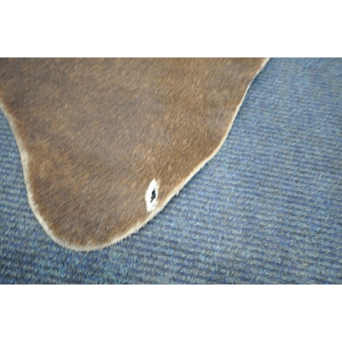 1320 - A HANLIN SOUTH AMERICAN NATURAL COWHIDE RUG, 160cm x 171cm (condition:-stitched repair to one area, ... 