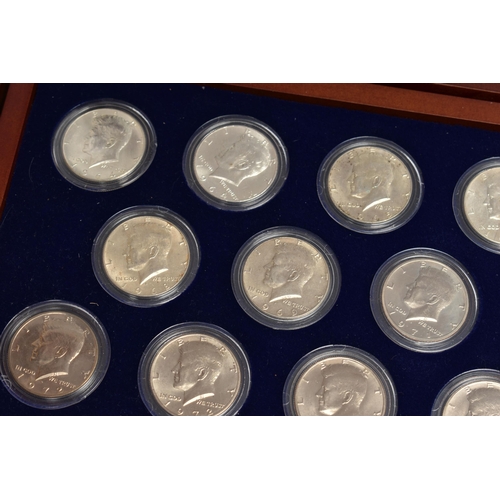 212 - A BOXED DISPLAY OF AMERICAN SILVER DOLLAR COINS, to include five different finishes genuine reverse ... 