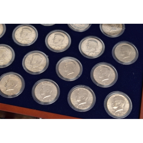 212 - A BOXED DISPLAY OF AMERICAN SILVER DOLLAR COINS, to include five different finishes genuine reverse ... 