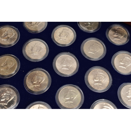 212 - A BOXED DISPLAY OF AMERICAN SILVER DOLLAR COINS, to include five different finishes genuine reverse ... 