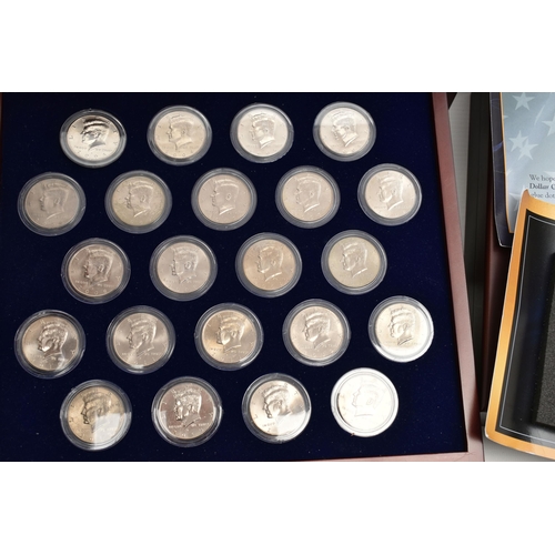 212 - A BOXED DISPLAY OF AMERICAN SILVER DOLLAR COINS, to include five different finishes genuine reverse ... 