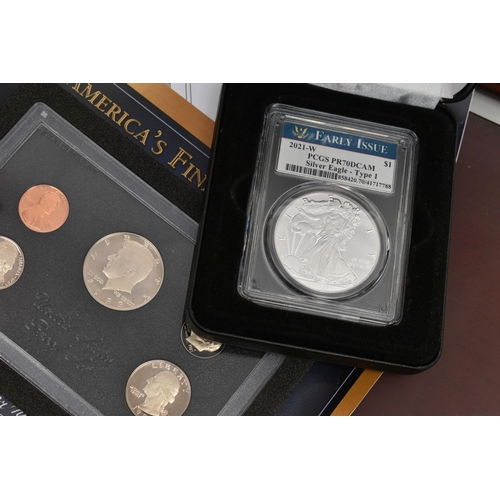 212 - A BOXED DISPLAY OF AMERICAN SILVER DOLLAR COINS, to include five different finishes genuine reverse ... 