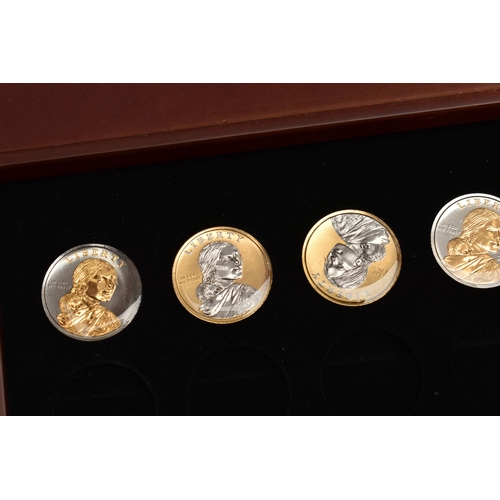 214 - A GLAZED BOXED SET OF ENHANCED KENNEDY HALF DOLLAR COINS, to include gold highlighted with uncircula... 