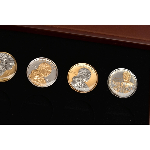 214 - A GLAZED BOXED SET OF ENHANCED KENNEDY HALF DOLLAR COINS, to include gold highlighted with uncircula... 