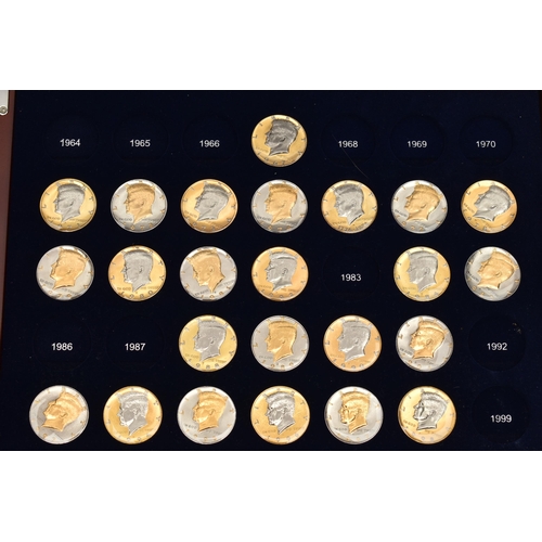 214 - A GLAZED BOXED SET OF ENHANCED KENNEDY HALF DOLLAR COINS, to include gold highlighted with uncircula... 