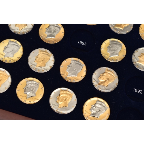 214 - A GLAZED BOXED SET OF ENHANCED KENNEDY HALF DOLLAR COINS, to include gold highlighted with uncircula... 