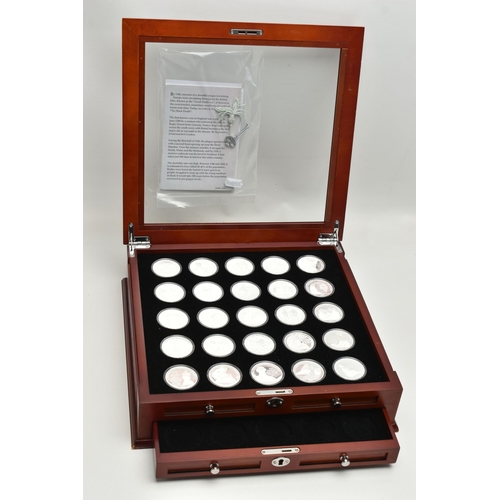 215 - A LARGE GLAZED BOX THE HISTORY OF BRITAIN SILVER BULLION PART COLLECTION, 27x  .999 silver 1oz  proo... 