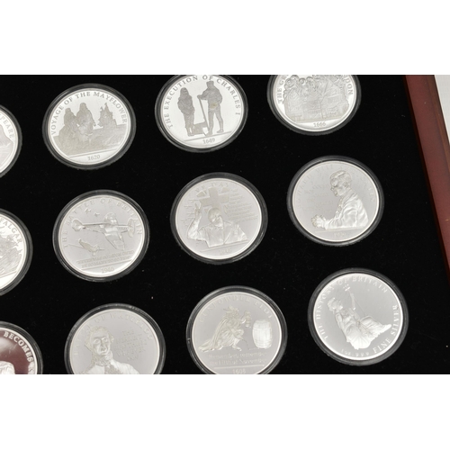 215 - A LARGE GLAZED BOX THE HISTORY OF BRITAIN SILVER BULLION PART COLLECTION, 27x  .999 silver 1oz  proo... 