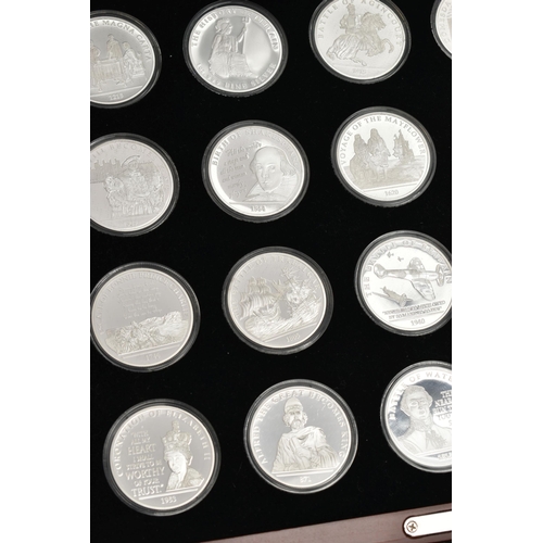 215 - A LARGE GLAZED BOX THE HISTORY OF BRITAIN SILVER BULLION PART COLLECTION, 27x  .999 silver 1oz  proo... 