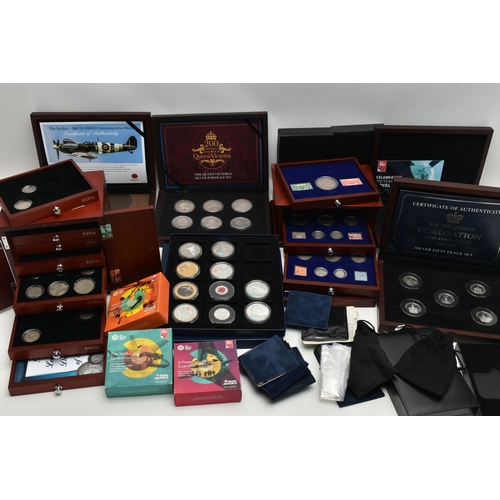 229 - A GLAZED DISPLAY BOX THREE DECADES of GEORGE V STAMP AND COIN SET, to include four trays of silver c... 