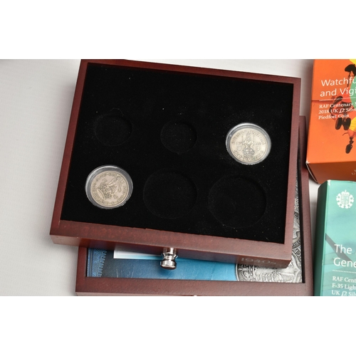 229 - A GLAZED DISPLAY BOX THREE DECADES of GEORGE V STAMP AND COIN SET, to include four trays of silver c... 