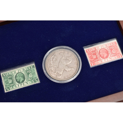 229 - A GLAZED DISPLAY BOX THREE DECADES of GEORGE V STAMP AND COIN SET, to include four trays of silver c... 