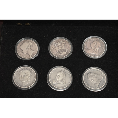 229 - A GLAZED DISPLAY BOX THREE DECADES of GEORGE V STAMP AND COIN SET, to include four trays of silver c... 