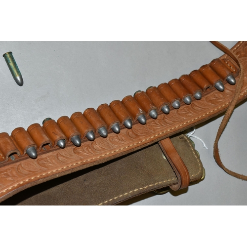 634 - A GOOD QUALITY HEAVILY TOOLED GUN BELT AND HOLSTER, with a number of inert cartridges