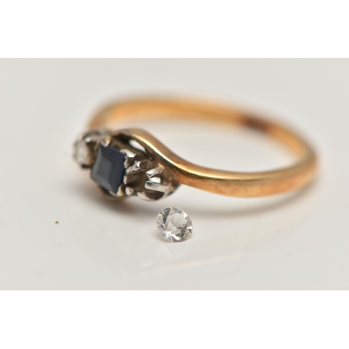 100 - A YELLOW METAL GEM SET RING, three stone mount set with a square cut sapphire and one single cut dia... 