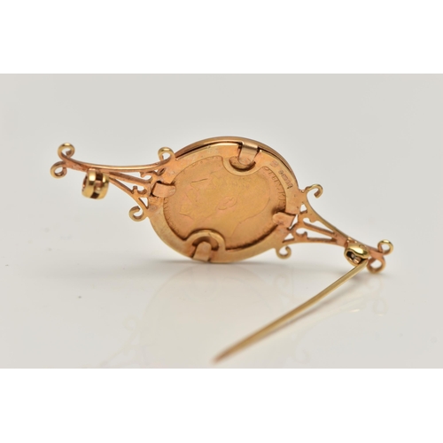 109 - AN EARLY 20TH CENTURY HALF SOVERIEGN BROOCH, George V, dated 1911, in a 9ct gold surmount with scrol... 