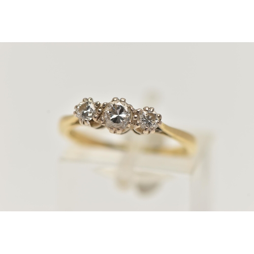 13 - A YELLOW METAL THREE STONE DIAMOND RING, designed with three claw set, round brilliant cut diamonds,... 