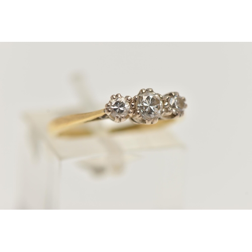 13 - A YELLOW METAL THREE STONE DIAMOND RING, designed with three claw set, round brilliant cut diamonds,... 