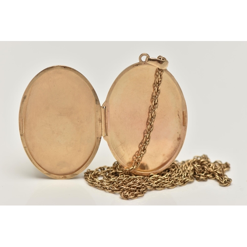 14 - A 9CT GOLD LOCKET AND CHAIN, oval locket with floral detail to the front, opens to reveal two compar... 