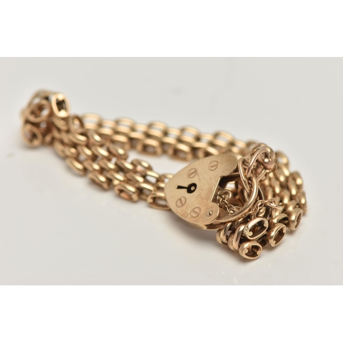 15 - A 9CT GOLD BRACELET, brick link bracelet, hallmarked 9ct Birmingham, fitted with a heart padlock cla... 