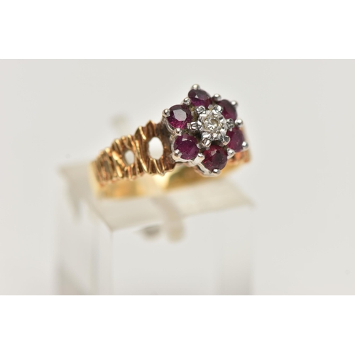 25 - A YELLOW METAL DIAMOND AND RUBY CLUSTER RING, centrally set with a single cut diamond illusion set, ... 