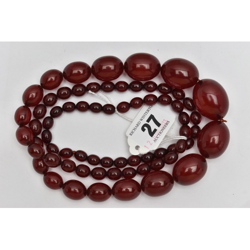 27 - A GRADUATED BAKELITE BEAD NECKLACE, comprising of sixty-nine beads measuring approximately 9mm to 29... 