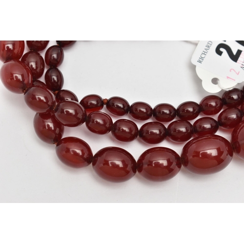 27 - A GRADUATED BAKELITE BEAD NECKLACE, comprising of sixty-nine beads measuring approximately 9mm to 29... 