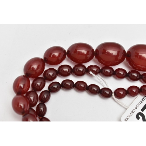 27 - A GRADUATED BAKELITE BEAD NECKLACE, comprising of sixty-nine beads measuring approximately 9mm to 29... 