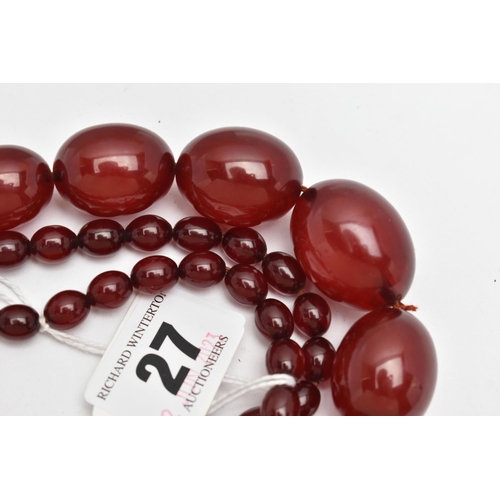 27 - A GRADUATED BAKELITE BEAD NECKLACE, comprising of sixty-nine beads measuring approximately 9mm to 29... 