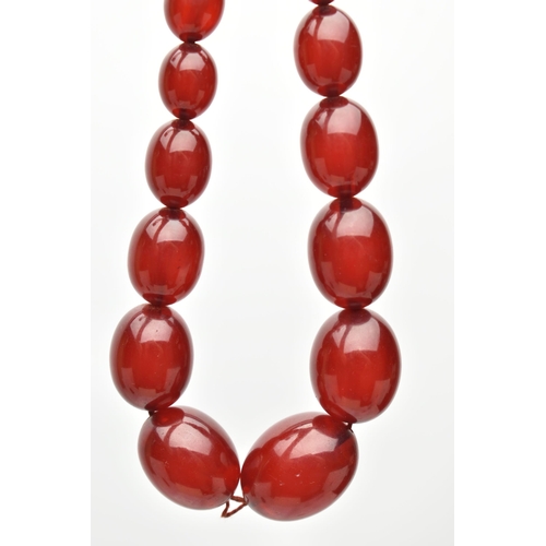 27 - A GRADUATED BAKELITE BEAD NECKLACE, comprising of sixty-nine beads measuring approximately 9mm to 29... 