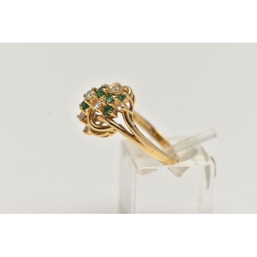 33 - AN 18CT GOLD, DIAMOND AND EMERALD DRESS RING, asymmetrical design set with seven round brilliant cut... 