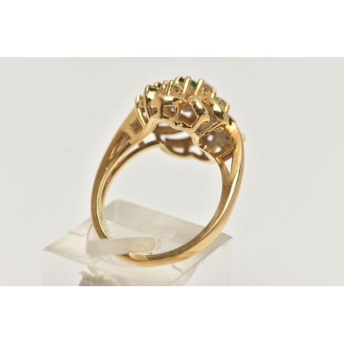 33 - AN 18CT GOLD, DIAMOND AND EMERALD DRESS RING, asymmetrical design set with seven round brilliant cut... 