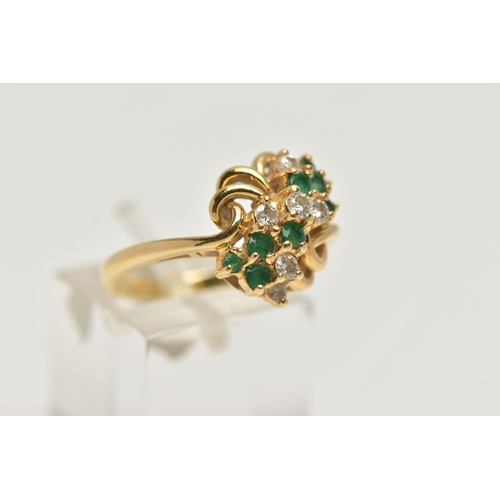 33 - AN 18CT GOLD, DIAMOND AND EMERALD DRESS RING, asymmetrical design set with seven round brilliant cut... 