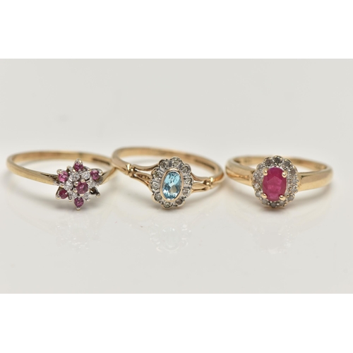 34 - THREE 9CT GOLD GEM SET RINGS, to include a topaz and diamond cluster, ring size O, a ruby and diamon... 