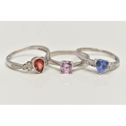 35 - THREE 9CT WHITE GOLD GEM SET RINGS, to include a garnet and diamond ring, ring size N, a tanzanite a... 