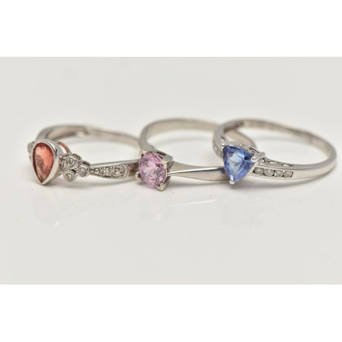 35 - THREE 9CT WHITE GOLD GEM SET RINGS, to include a garnet and diamond ring, ring size N, a tanzanite a... 