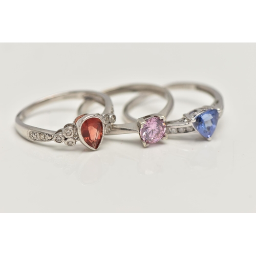 35 - THREE 9CT WHITE GOLD GEM SET RINGS, to include a garnet and diamond ring, ring size N, a tanzanite a... 