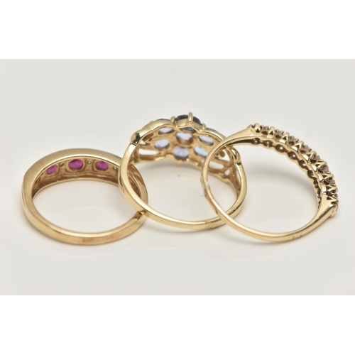 43 - THREE 9CT GOLD GEM SET RINGS, to include a ruby and diamond half eternity ring, hallmarked 9ct Londo... 