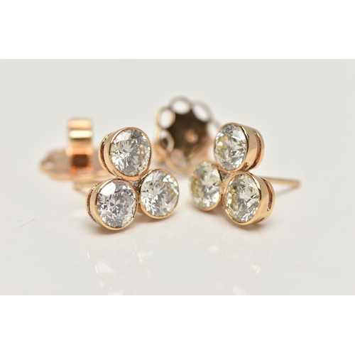 5 - A PAIR OF 6 CARAT DIAMOND STUD EARRINGS, each earring comprising of three round brilliant cut diamon... 