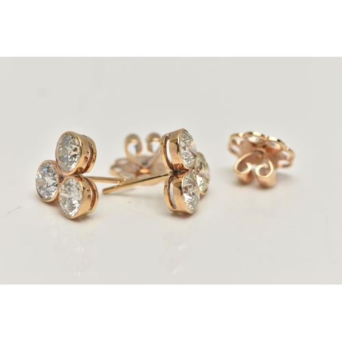 5 - A PAIR OF 6 CARAT DIAMOND STUD EARRINGS, each earring comprising of three round brilliant cut diamon... 