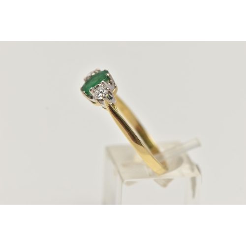 50 - AN 18CT EMERALD AND DIAMOND RING, designed with a central oval cut emerald, claw set, flanked with t... 