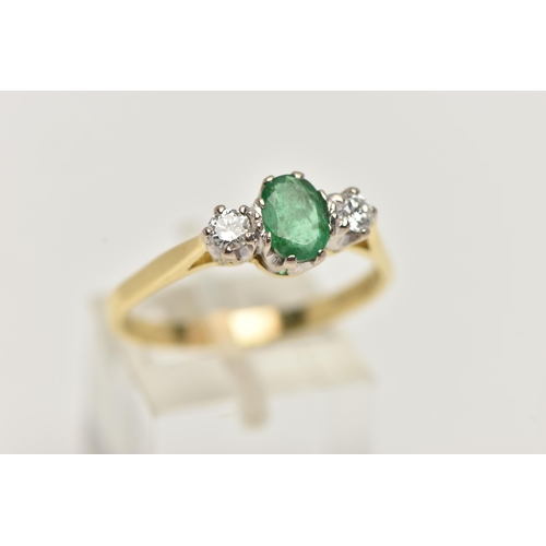 50 - AN 18CT EMERALD AND DIAMOND RING, designed with a central oval cut emerald, claw set, flanked with t... 