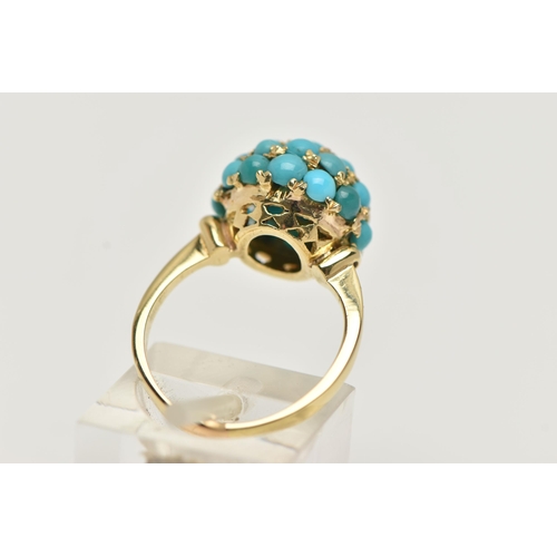 56 - A YELLOW METAL TURQUOISE DOME RING, circular dome set with turquoise cabochons, raised on an open wo... 