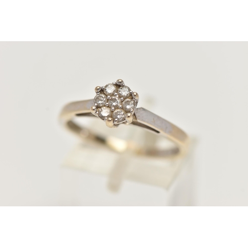 89 - A WHITE GOLD DIAMOND CLUSTER RING, small cluster of seven round brilliant cut diamonds, stamped diam... 