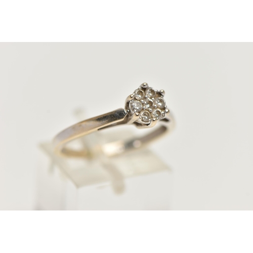 89 - A WHITE GOLD DIAMOND CLUSTER RING, small cluster of seven round brilliant cut diamonds, stamped diam... 