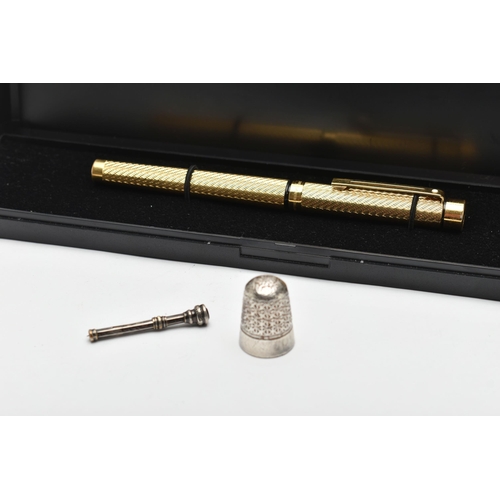 157 - A GOLD PLATED 'SHEAFFER' FOUNTAIN PEN A THIMBLE AND TOOTHPICK, gold plated engine turned pattern fou... 